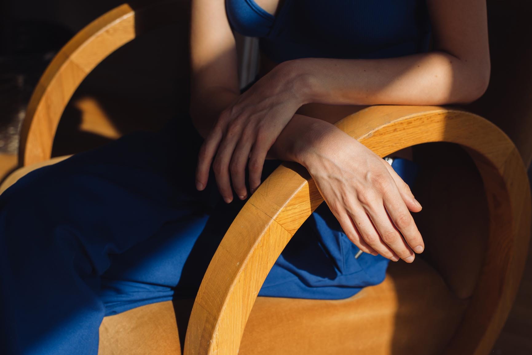 Anonymous woman hands illuminated with direct sunlight